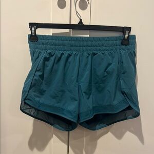 Athleta mesh racer 4 inch high rise running shorts Teal Athletic Shorts